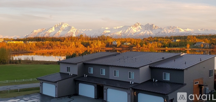 A house with a mountain range in the background.
