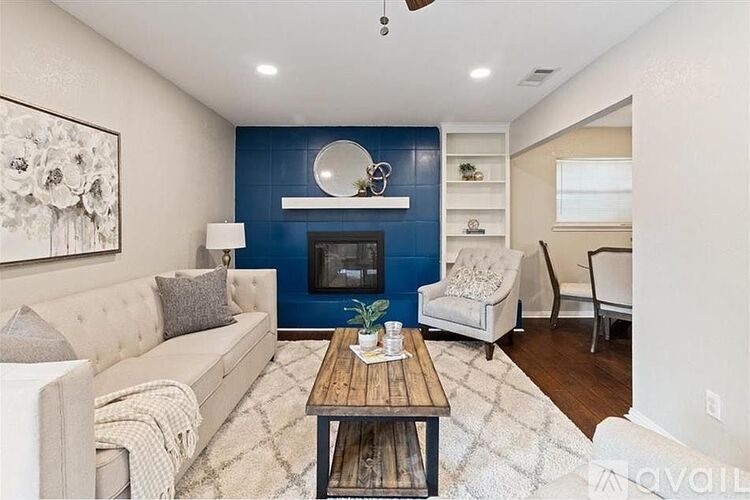 A living room with a fireplace and a couch.