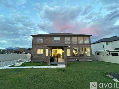 A house with a front yard is available for sale.