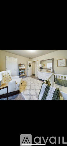 A living room with a couch and a chair.