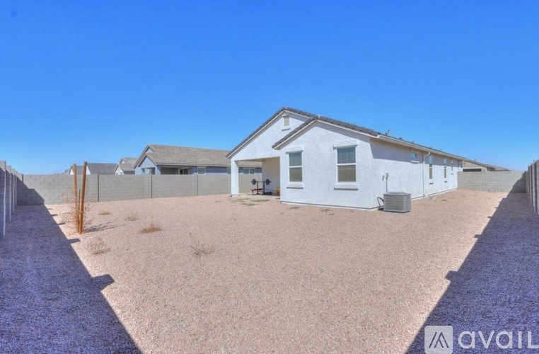 A house with a white exterior is available for sale.