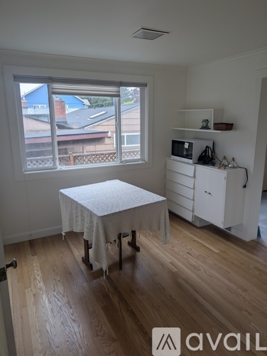 A room with a table and a cabinet.