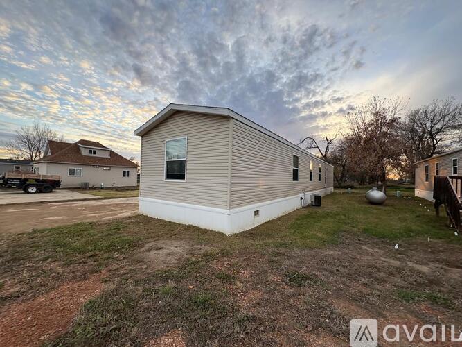 A house with a metal siding is available for rent.