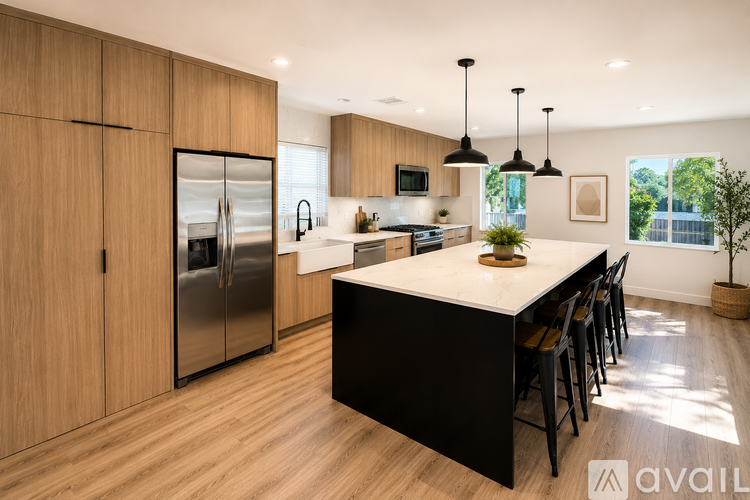 A modern kitchen with wooden cabinets and a central island.