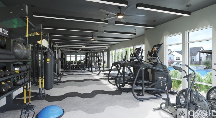 A gym with a variety of equipment including treadmills, weights, and exercise bikes.