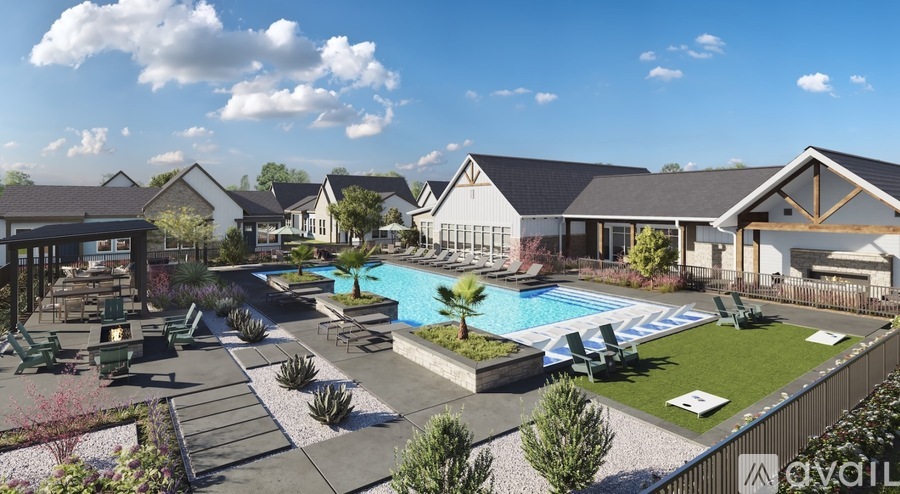 A large outdoor swimming pool surrounded by lounge chairs and umbrellas.