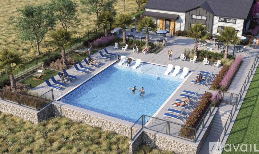 A large outdoor swimming pool surrounded by lawn chairs and trees.