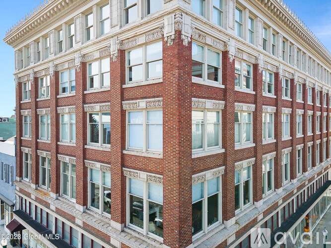 A red brick building with white trim and windows.