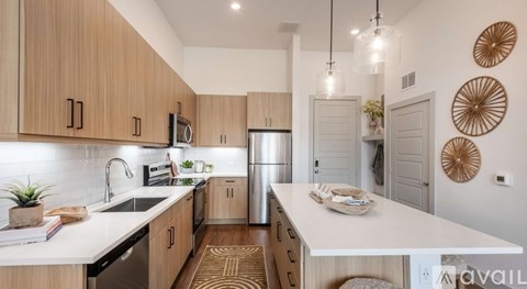 A kitchen with wooden cabinets and a white countertop.