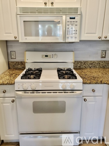 A white stove and oven in a kitchen.