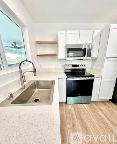 A kitchen with a sink and a dishwasher.