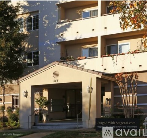 The image shows a building with the number 655 on it.
