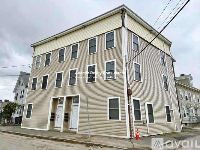 A two-story building with a sign that says "Plant Rehabilitation Consultant" on the front.