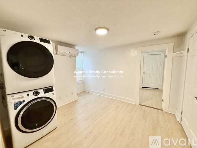 A laundry room with a washer and dryer.