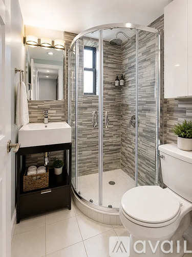A bathroom with a walk in shower and a toilet.
