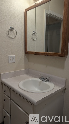 A bathroom sink with a mirror above it.