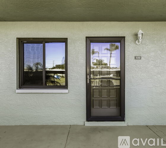 A house number 132 with a black door and window.