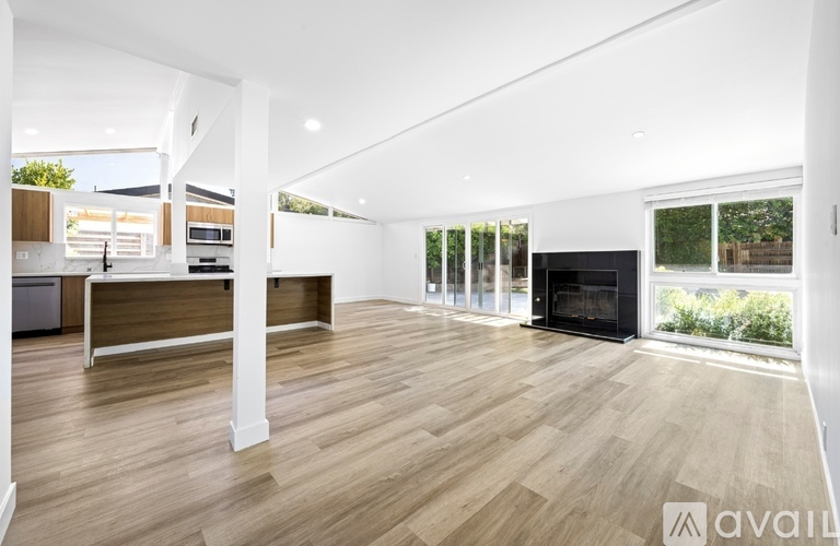 A modern living room with a black and white theme.
