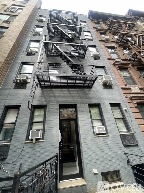 A building with a fire escape on the side.