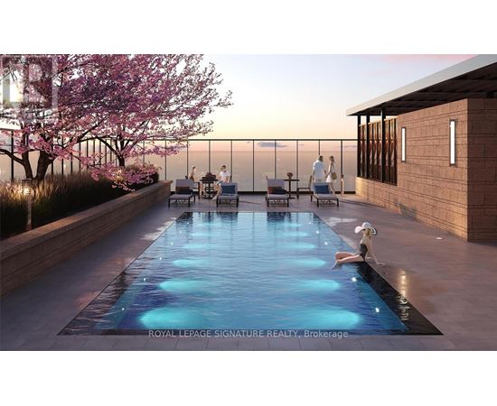 A pool with people sitting on the edge and a dog sitting in the middle of the pool.