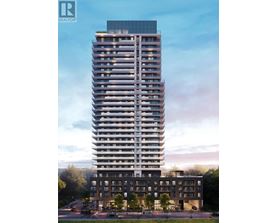 A tall residential building with a glass top and a smaller building in front of it.
