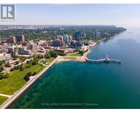 A cityscape with a body of water and a pier.