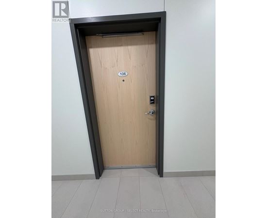A wooden door with the number 106 on it.
