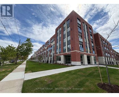 A large red brick building with a walkway in front of it.