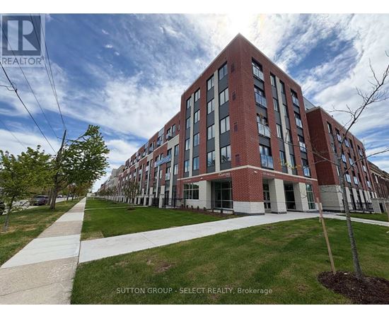 A large red brick building with a walkway in front of it.