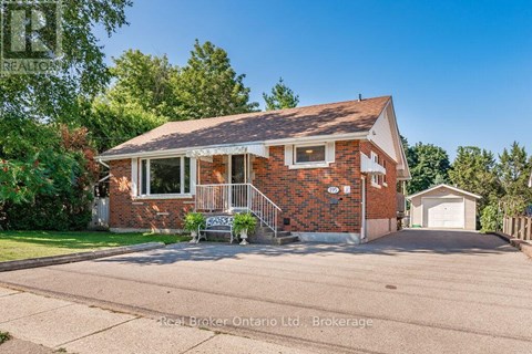 A house with a red brick exterior and a white window is for sale.