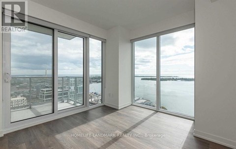 A room with a view of the city and water.