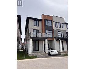 A modern two-story house with a car parked in front.