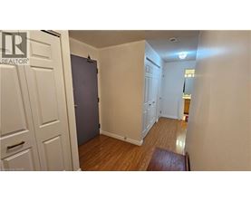 A room with a wooden floor and white walls.