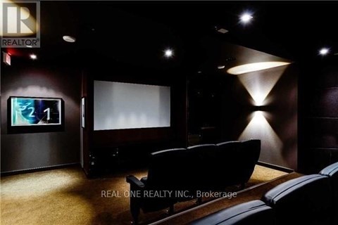 A modern living room with a couch and a flat screen TV.