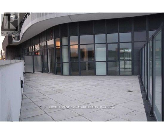 A building with glass walls and a sign that says "Royal LePage Signature Realty Brokerage".