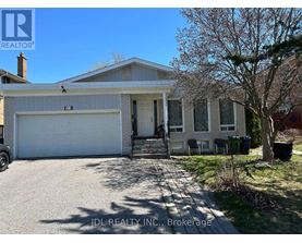 A house with a white garage door is for sale.