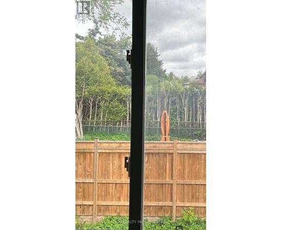 A wooden fence with a gate in the middle.