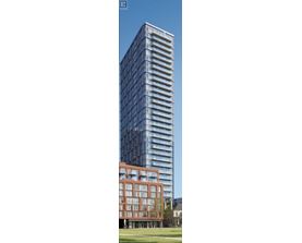 A tall building with many windows is shown in the image.
