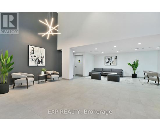 A modern living room with a grey couch and a white chair.