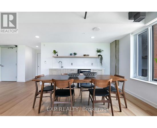 A dining room with a table set for six.
