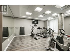 A gym with treadmills and exercise bikes is available at RE/MAX All-Stars Realty, Inc. Brokerage.