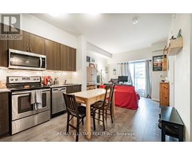 A kitchen with a table and chairs in the middle of the room.