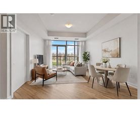 A well-lit, modern living room with a dining area and a large window.