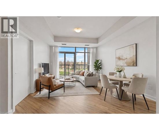 A well-lit, modern living room with a dining area and a large window.