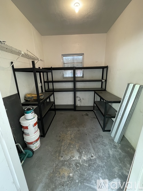 A room with a bunk bed and a fire extinguisher.