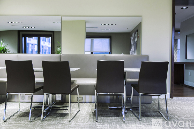 A conference room with a long table and chairs.