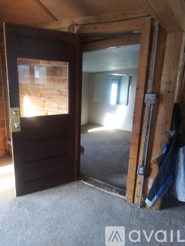 A room with a door and a window.