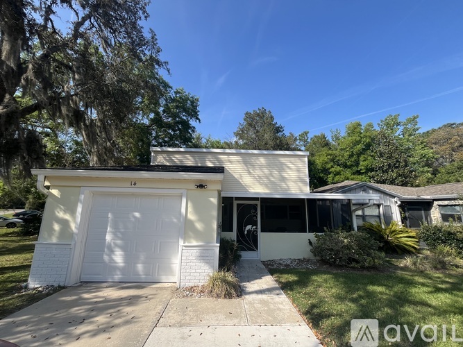 A house with a white garage door is for sale.