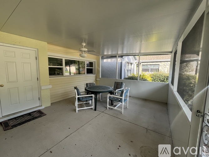 A patio with a table and chairs is shown.
