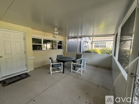 A patio with a table and chairs is shown.